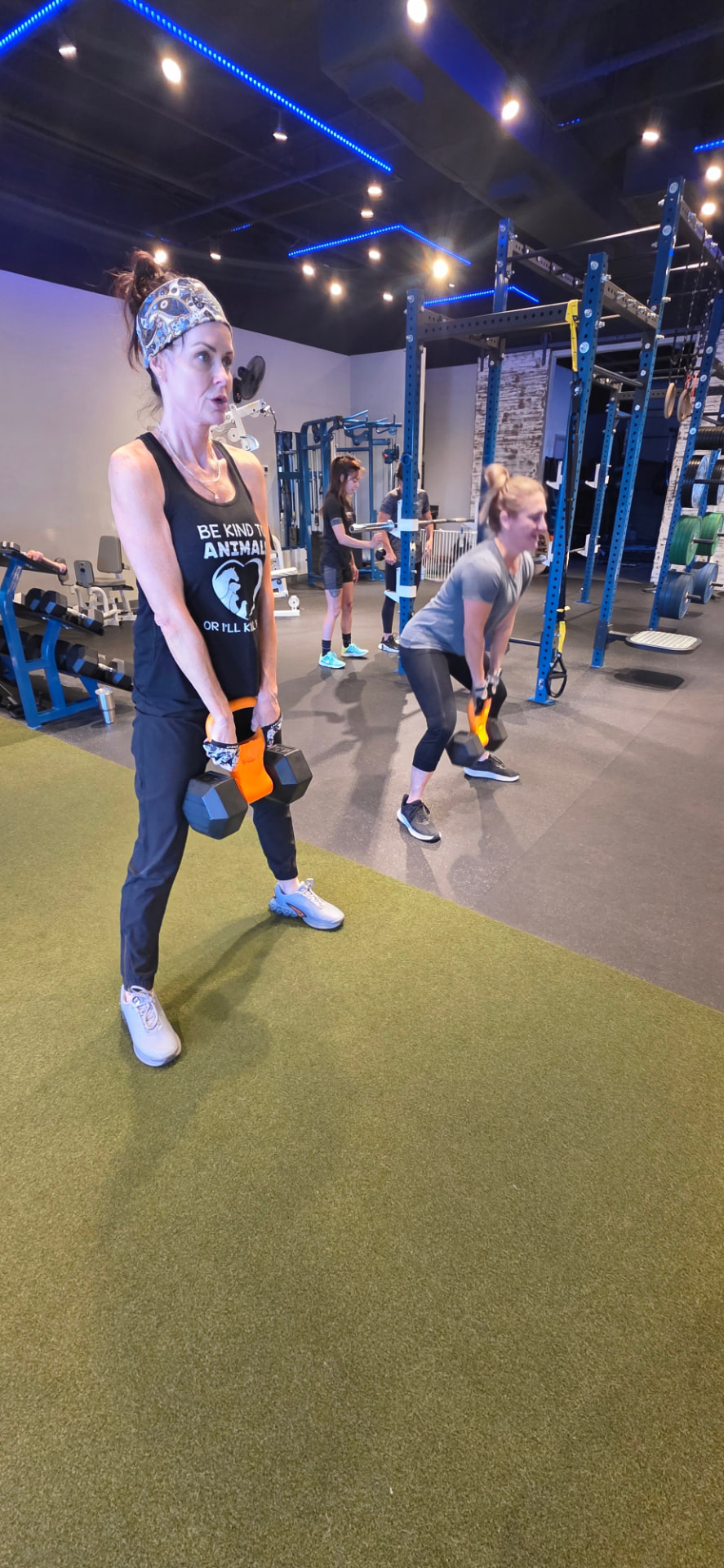 Small group of women strength training with dumbbells at the private Everybitfit studio in Scottsdale